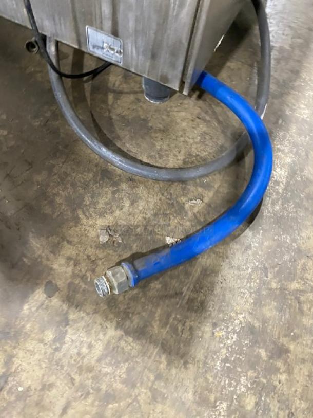 Rational SelfCooking Center electric combi oven, model SCC102G, on legs with wired oven rack. Visible hoses attached.