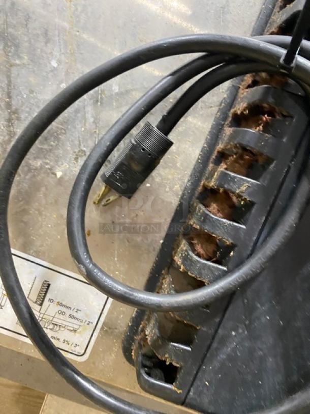 Rational SelfCooking Center SCCWE201G, commercial stainless steel combi oven. Electric powered. On legs, visible power cord.