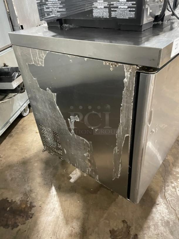 Migali CU60RHC commercial stainless steel 2-door undercounter refrigerator on casters, showing cosmetic wear on the surface.