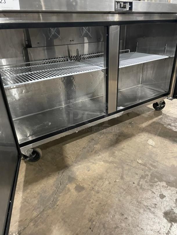 Migali Commercial 2-Door Stainless Steel Refrigerator, Model CU60RHC, featuring poly coated wired rack and casters.