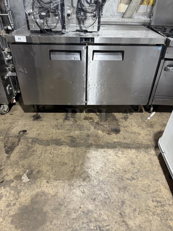 Migali CU60RHC stainless steel 2-door undercounter refrigerator on casters, with poly-coated wired rack, 115V 1 phase.