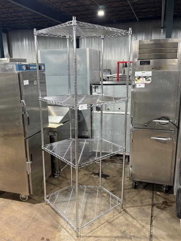 Metal Metro 4 tier corner rack system, silver wire shelving, sturdy construction. Ideal for space-efficient storage solutions.