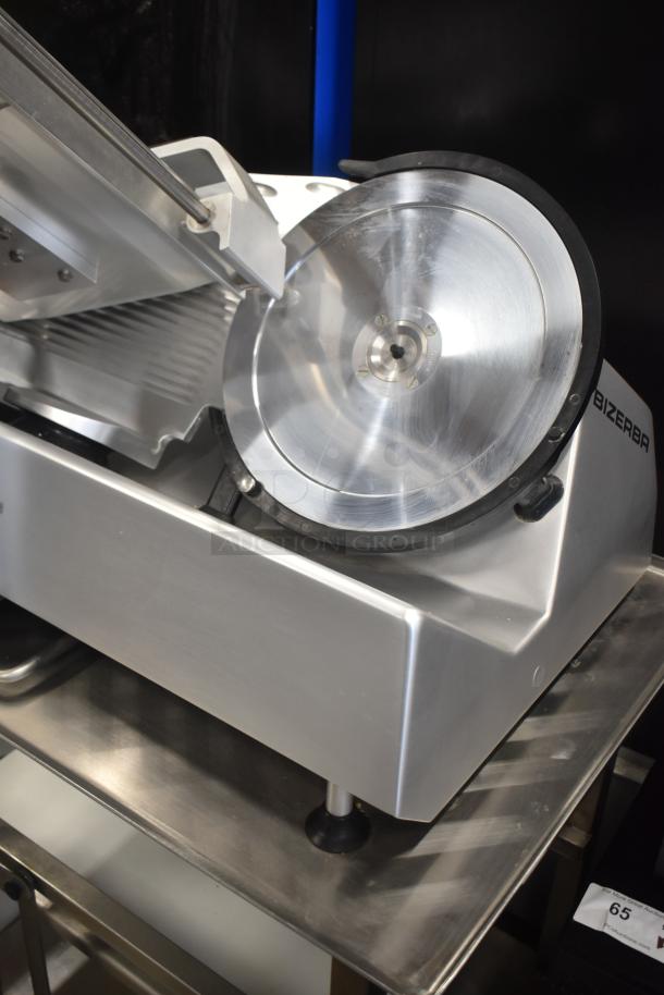 2023 Bizerba GSP H Commercial Meat Slicer with blade sharpener, on Face to Face Equipment Stand. 120V, 1 Phase.
