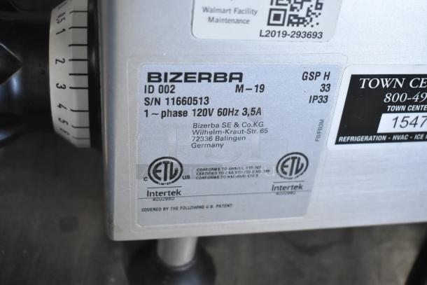 2019 Bizerba GSP H commercial meat slicer with blade sharpener; 120V, 1 phase. Label shows serial number and certifications.