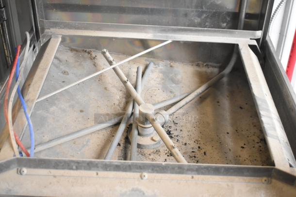 BRAND NEW SCRATCH AND DENT! 2018 Noble WAREFORCE I-E pass through dishwasher interior, showing spray arms and electrical wiring.