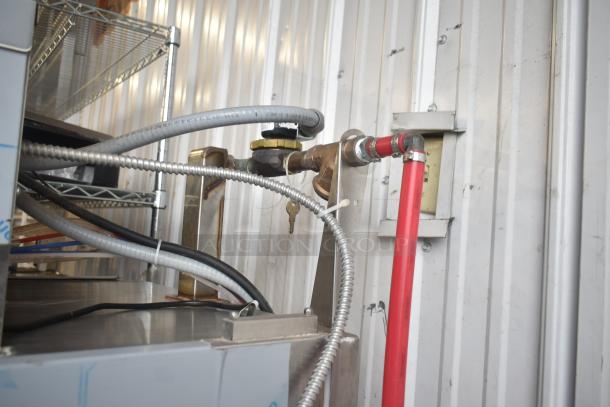 Brand new Noble WAREFORCE I-E commercial pass-through dishwasher, 2018 model, 115 volts, 1 phase, with visible piping connections.