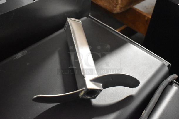 Stephan VCM44A/1 Cutter Mixer blade on dark surface, showing metal construction and sharp edges.