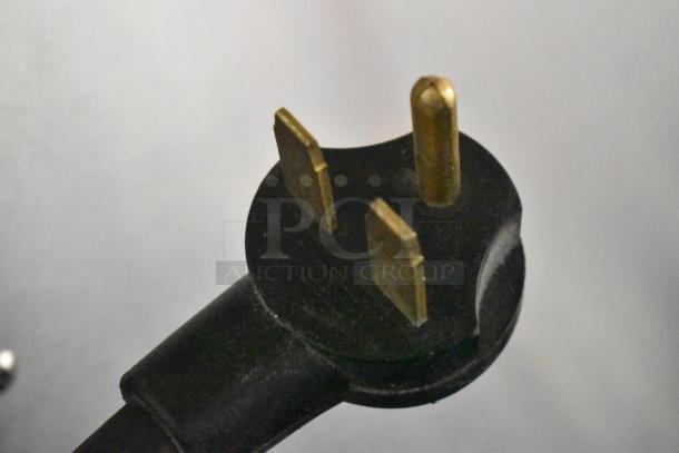 Close-up of a three-prong power plug for a 2022 Turbochef NGO rapid cook oven, 208/240V, 1 Phase.