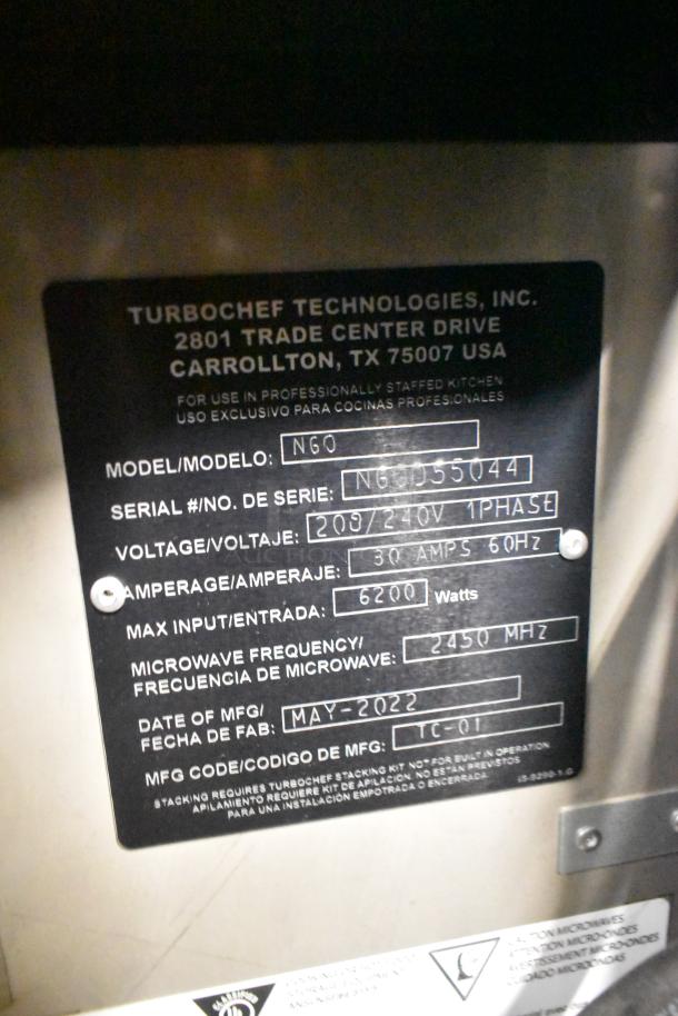 Close-up of Turbochef NGO oven label showing model, serial number, voltage, and manufacturing date as May 2022.