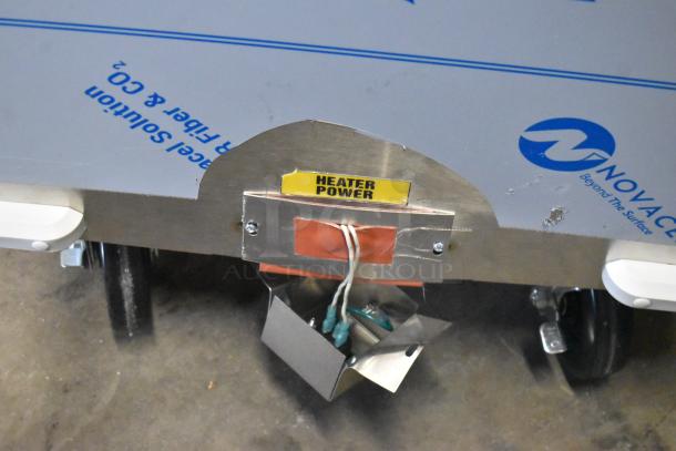 BRAND NEW Frontline 47SS grease caddy, commercial casters, heater power label visible, minor scratches.