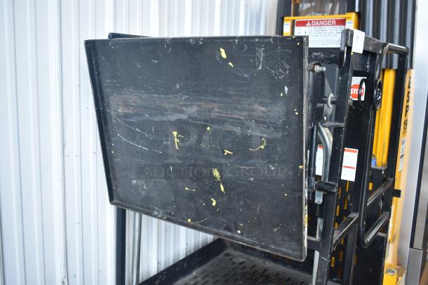 Bil Jax ESP-19 Haulotte 450 lb capacity man lift stock picker, showing worn platform with scratches, safety labels visible.
