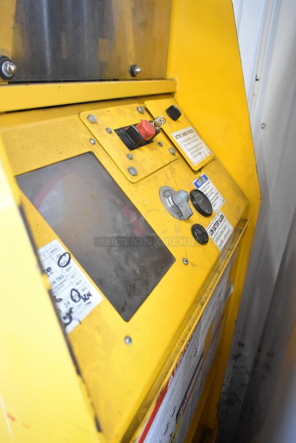 Bil Jax ESP-19 Haulotte 450 lb capacity man lift control panel, yellow, visible dials and safety labels.