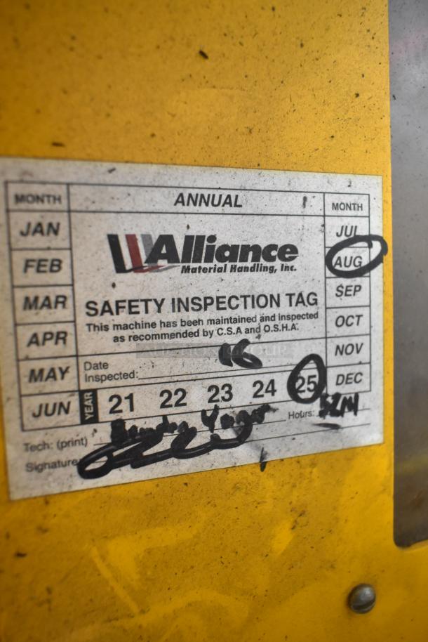 Safety inspection tag for Bil Jax ESP-19 Haulotte man lift showing annual inspection marked for August.