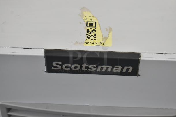 BRAND NEW Scotsman MC0330MAX-1A ice machine showing logo and label with scratches, 30" wide, 400 lb capacity, 115V.