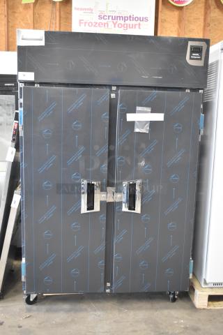 Brand new Delfield 6051XL-S commercial two-door reach-in cooler. Scratch and dent condition, on casters, 115V, 1 phase.