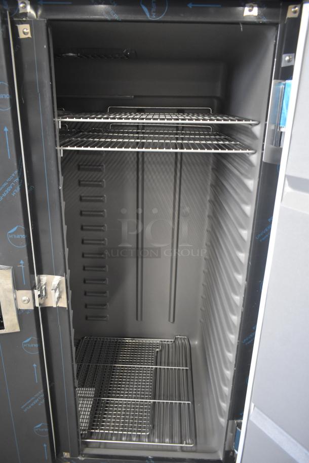 Brand new Delfield 6051XL-S commercial 2-door reach-in cooler, with shelves visible, on casters, 115V, 1-phase.