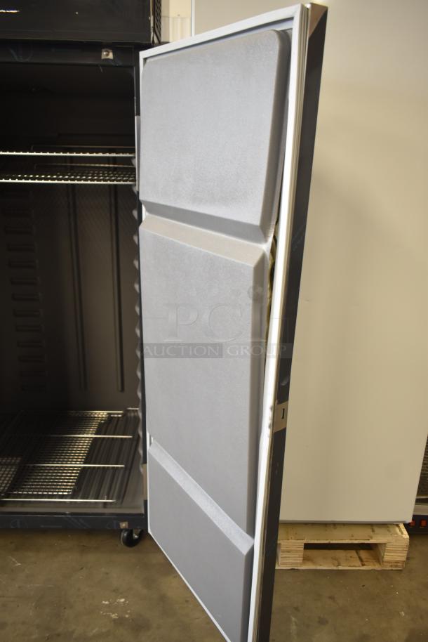 Brand new 2026 Delfield 6051XL-S 2-door reach-in cooler, scratch and dent, on casters, 115V, 1 phase, open door view.