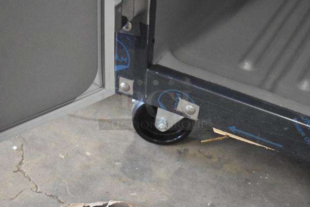 BRAND NEW Delfield 6051XL-S commercial cooler, scratch and dent condition, on casters, 115V, 1 phase. Close-up view.