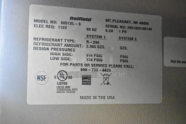 Alt text: "Delfield 6051XL-S commercial cooler label showing model, 115V, R-290 refrigerant, and NSF certification."