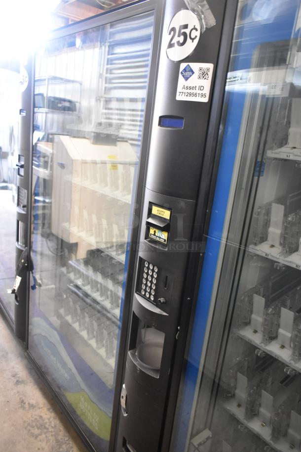 Crane 5800-4 metal vending machine with bill acceptor, 115 volts, 1 phase, commercial use, 25¢ pricing label visible.