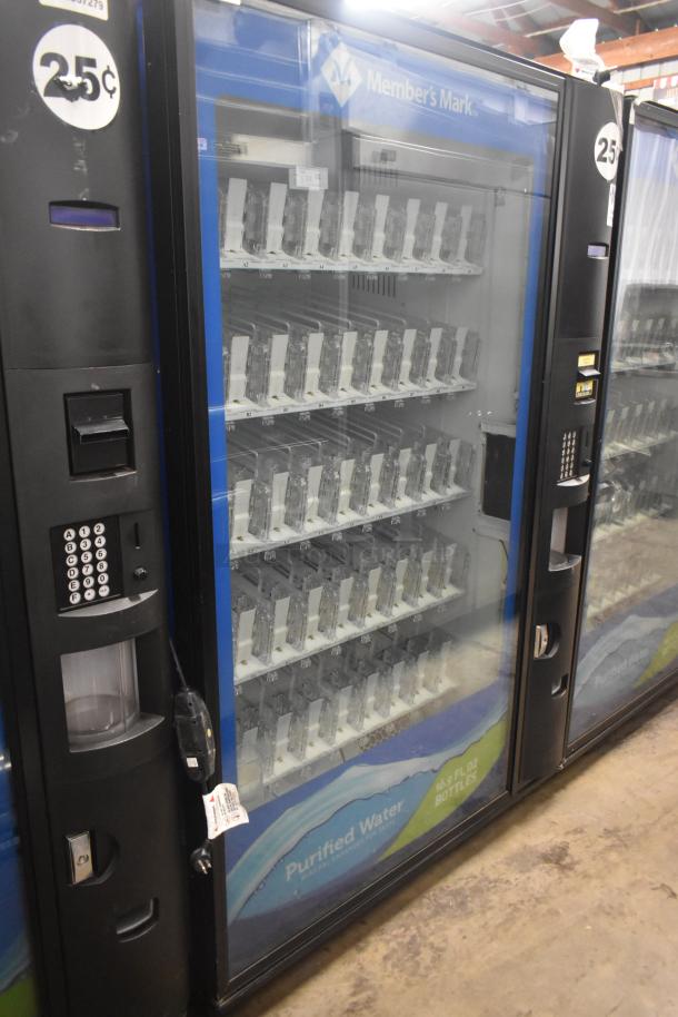 Crane 5800-4 metal commercial vending machine with bill acceptor, 115V, holds bottled drinks. Features keypad and pricing labels.