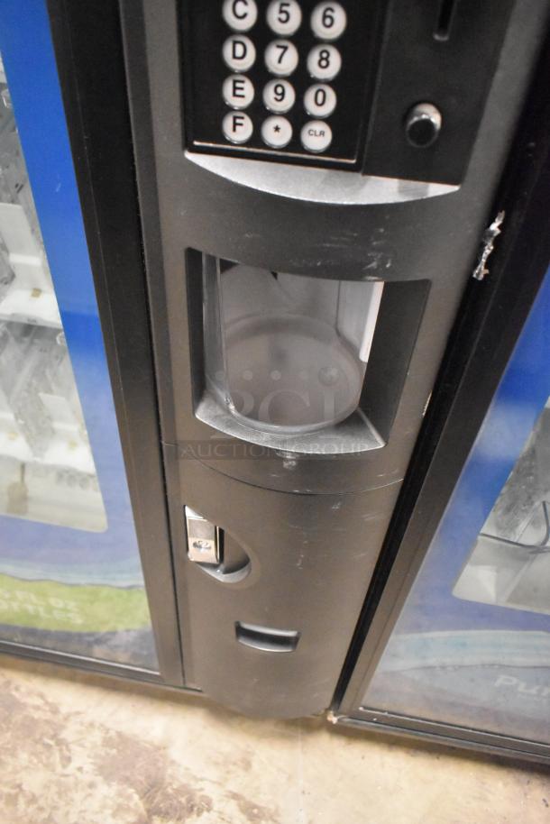 Crane 5800-4 metal commercial drink vending machine, features bill acceptor, keypad, 115 volts, 1 phase, good condition.