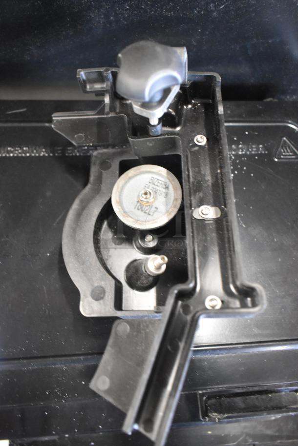 Bizerba SE 12 D US commercial meat slicer with blade sharpener, shown in sleek black, 120V, 1 Phase, excellent condition.