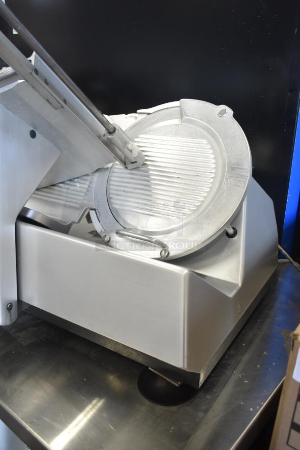 Bizerba SE 12 D US commercial meat slicer with blade sharpener, 120 volts, 1 phase. Sturdy stainless steel construction.