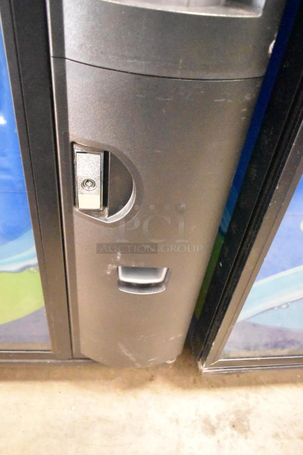 Crane 5800-4 metal commercial drink vending machine, features bill acceptor, 115 volts, 1 phase, slight wear visible.