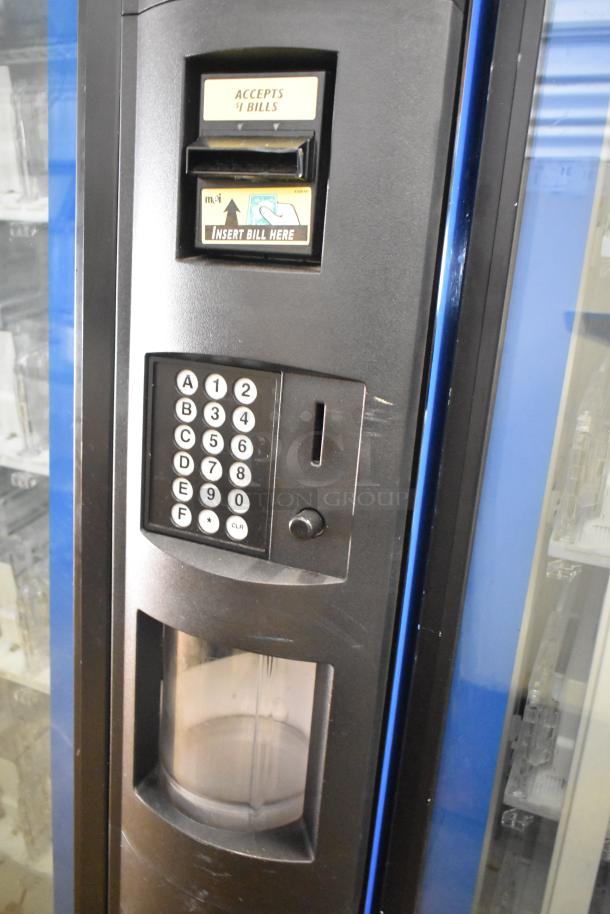 Crane 5800-4 commercial vending machine, metal, bill acceptor, keypad, 115V, 1 phase, visible label accepts $1 bills.