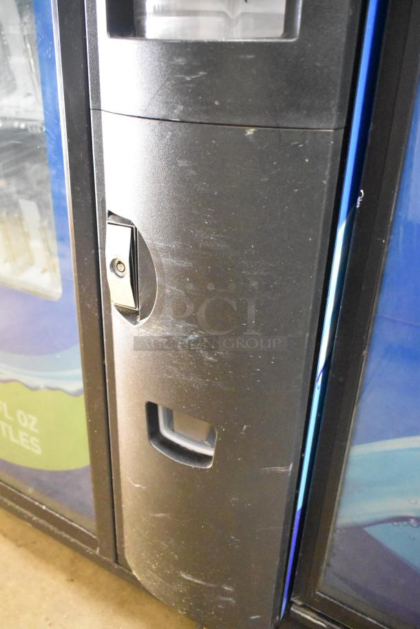 Crane 5800-4 metal drink vending machine, with bill acceptor, 115V, 1 phase, showing keypad and slot. Signs of wear visible.