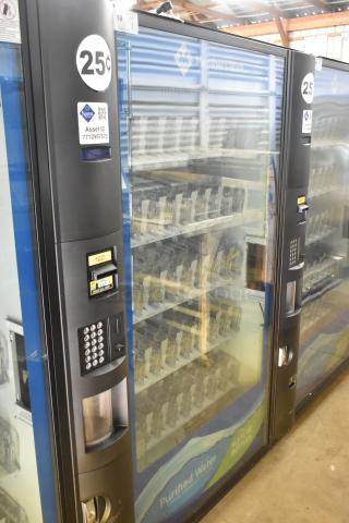 Crane 5800-4 metal drink vending machine with bill acceptor, 115 volts, 1 phase. Features glass front and keypad, in used condition.