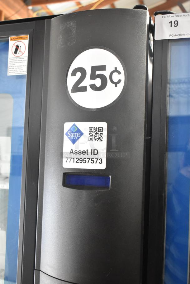 Crane 5800-4 vending machine, metal, bill acceptor, 25¢ label, Sam's Club Asset ID 7712957573, 115 volts, 1 phase.