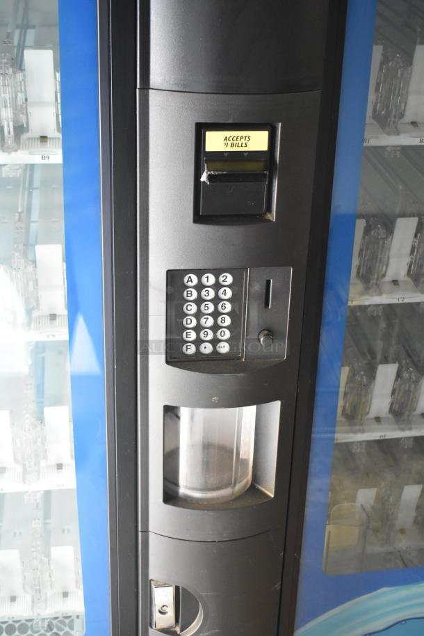 Crane 5800-4 commercial drink vending machine, metal, bill acceptor, keypad, 115V, 1 phase. Visible wear on surface.