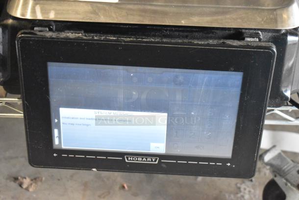 2016 Hobart HTi-7LH commercial countertop scale, tested and working, displays initialization message, Hobart logo visible.