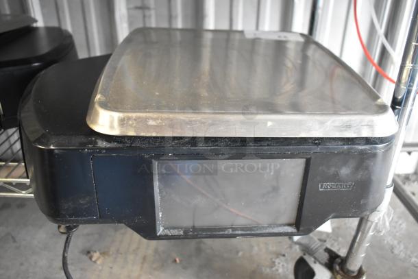 2016 Hobart HTi-7LH commercial countertop scale, black with stainless top. Tested and working, 120/208-240V, 1 Phase.