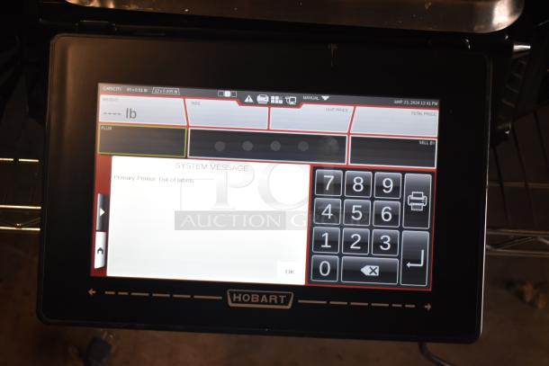 2024 Hobart HTi-7LH4W commercial scale, touchscreen interface, 120/208-240V, tested and working, "Out of labels" message visible.