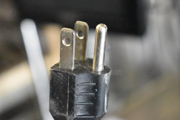 Close-up of a plug for the 2024 Hobart HTi-7LH4W Commercial Countertop Scale, 120/208-240 Volts, 1 Phase.