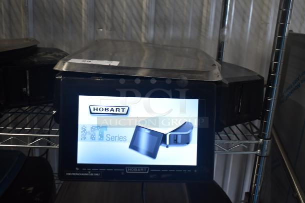 2024 Hobart HTi-7LH4W commercial scale with screen damage and missing left side button. 120/208-240V, 1 phase. Tested working.