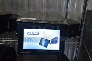 2024 Hobart HTi-7LH4W commercial scale with screen damage and missing left side button. 120/208-240V, 1 phase. Tested working.