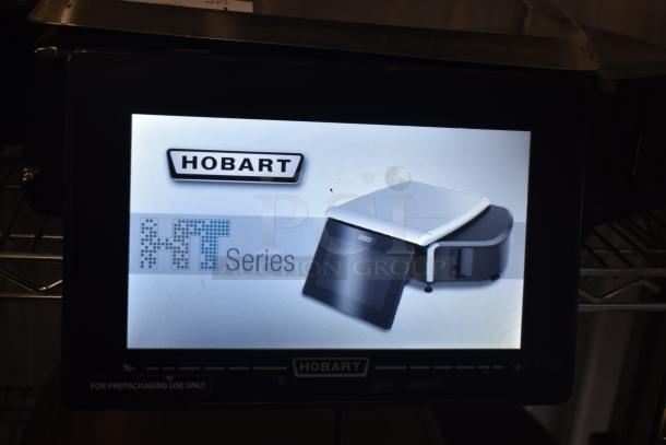 2024 Hobart HTi-7LH4W countertop scale, tested, screen damage visible, missing left side button. 120/208-240V, 1 phase.
