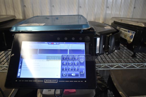 2018 Hobart HTi-7LH26 commercial scale, working condition, 120/208-240V, digital display on metal shelf.