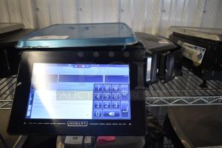2018 Hobart HTi-7LH26 commercial scale, working condition, 120/208-240V, digital display on metal shelf.