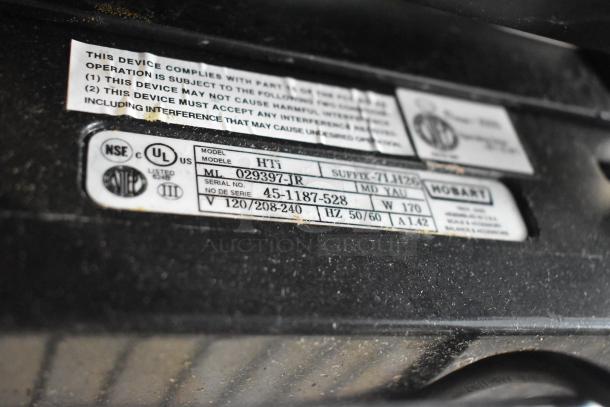 2018 Hobart HTi-7LH26 commercial countertop scale label. Voltage: 120/208-240V, 1 Phase. Model and serial numbers visible.
