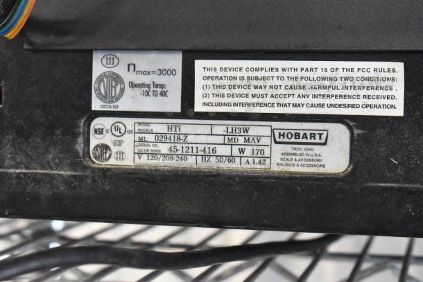 2019 Hobart HTi-LH3W commercial countertop scale with screen damage. Tested working. 120/208-240V, 1 Phase. Model label shown.