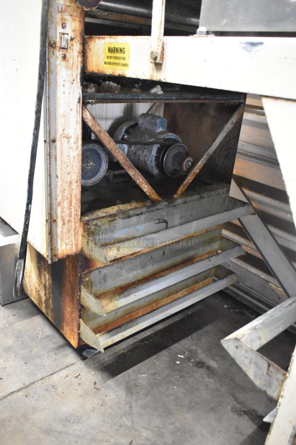Moline commercial floor-style dough sheeter with visible wear and rust on metal parts. Warning label present. 125V, 1 Phase.