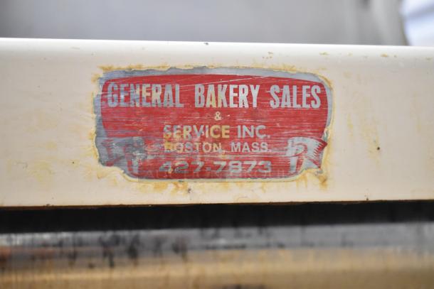 Moline Commercial Floor Dough Sheeter on casters, 125V, 1 phase. Red label shows "General Bakery Sales & Service Inc, Boston, Mass."