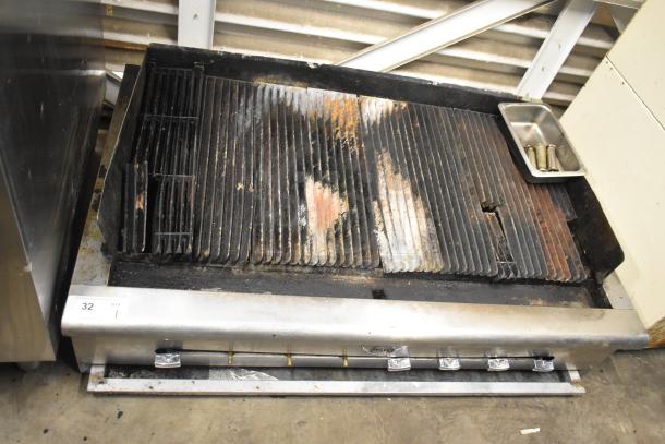 Wells Commercial countertop gas charbroiler grill, stainless steel, used condition with visible grill marks and controls.