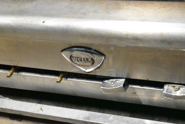 Wells Commercial Gas Charbroiler Grill, stainless steel, countertop model, visible Wells logo, used condition.