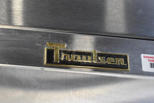 Traulsen ALT132WUT-HHS commercial freezer with logo and facility sticker visible. Stainless steel, two half-size doors.